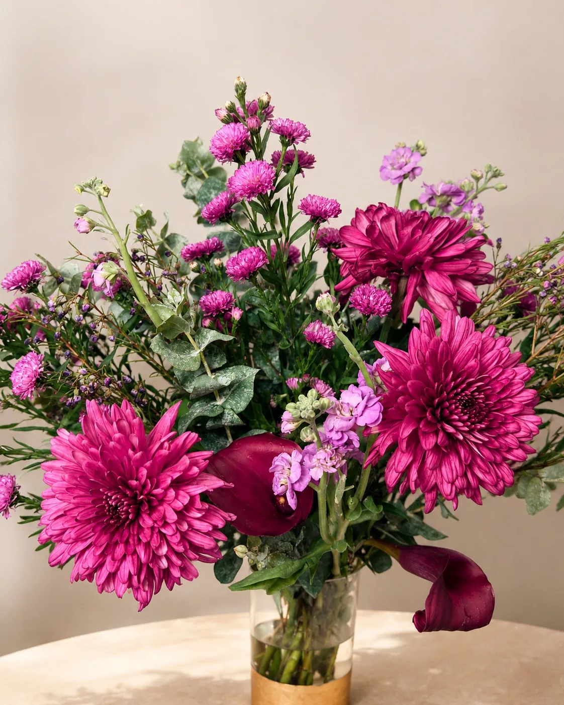 Magenta chrysanthemums and callas